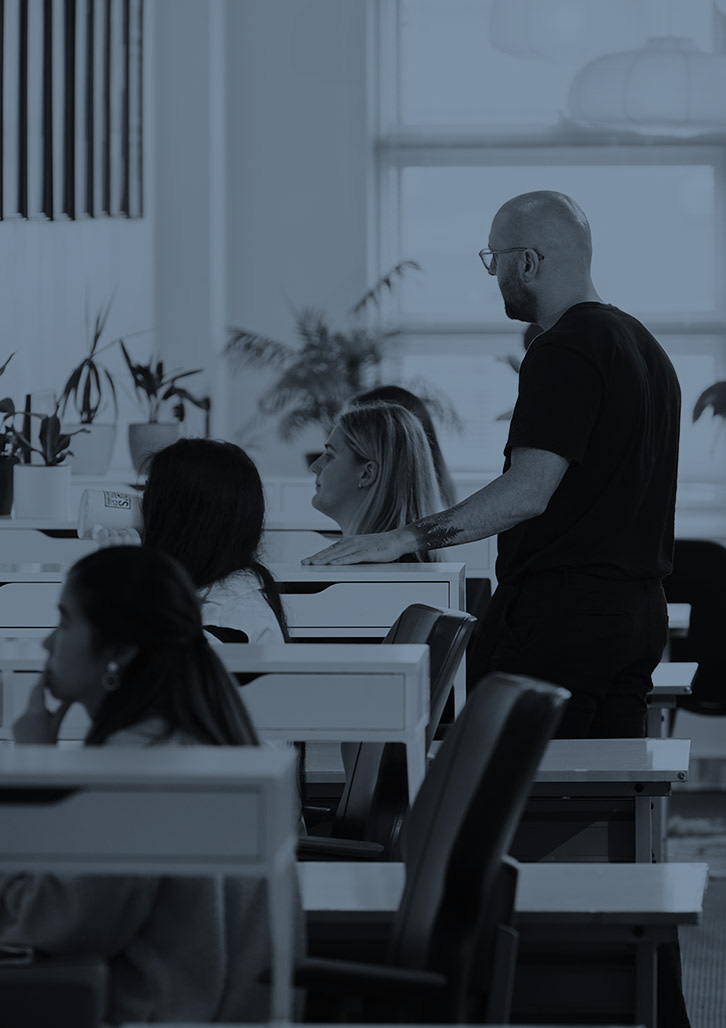 An image of the award winning designers of Sydney Design Agency, Percept. It shows them working in the creative studio and earning a reputation among the top design agencies in Sydney.